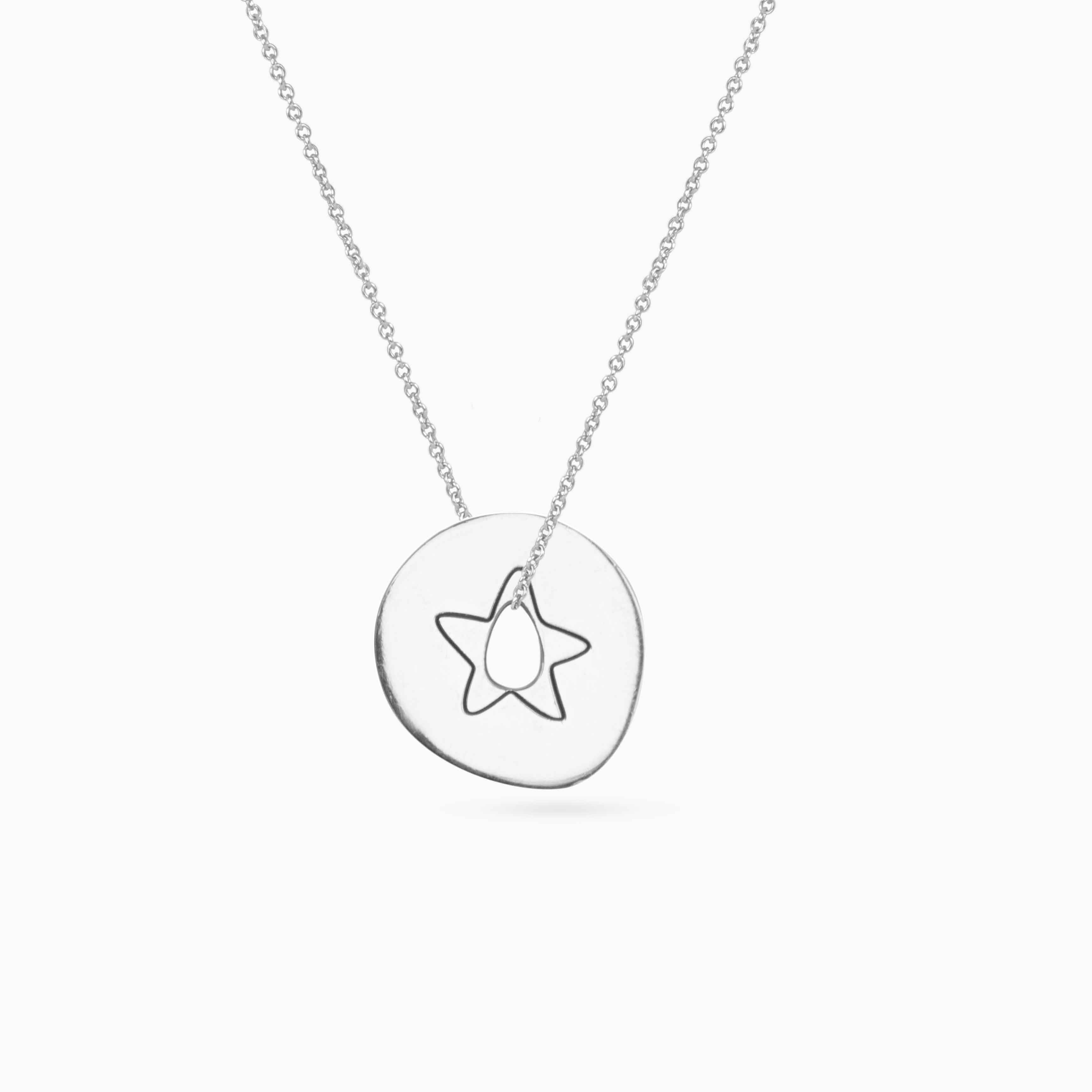 white gold pendant with a star on a woman