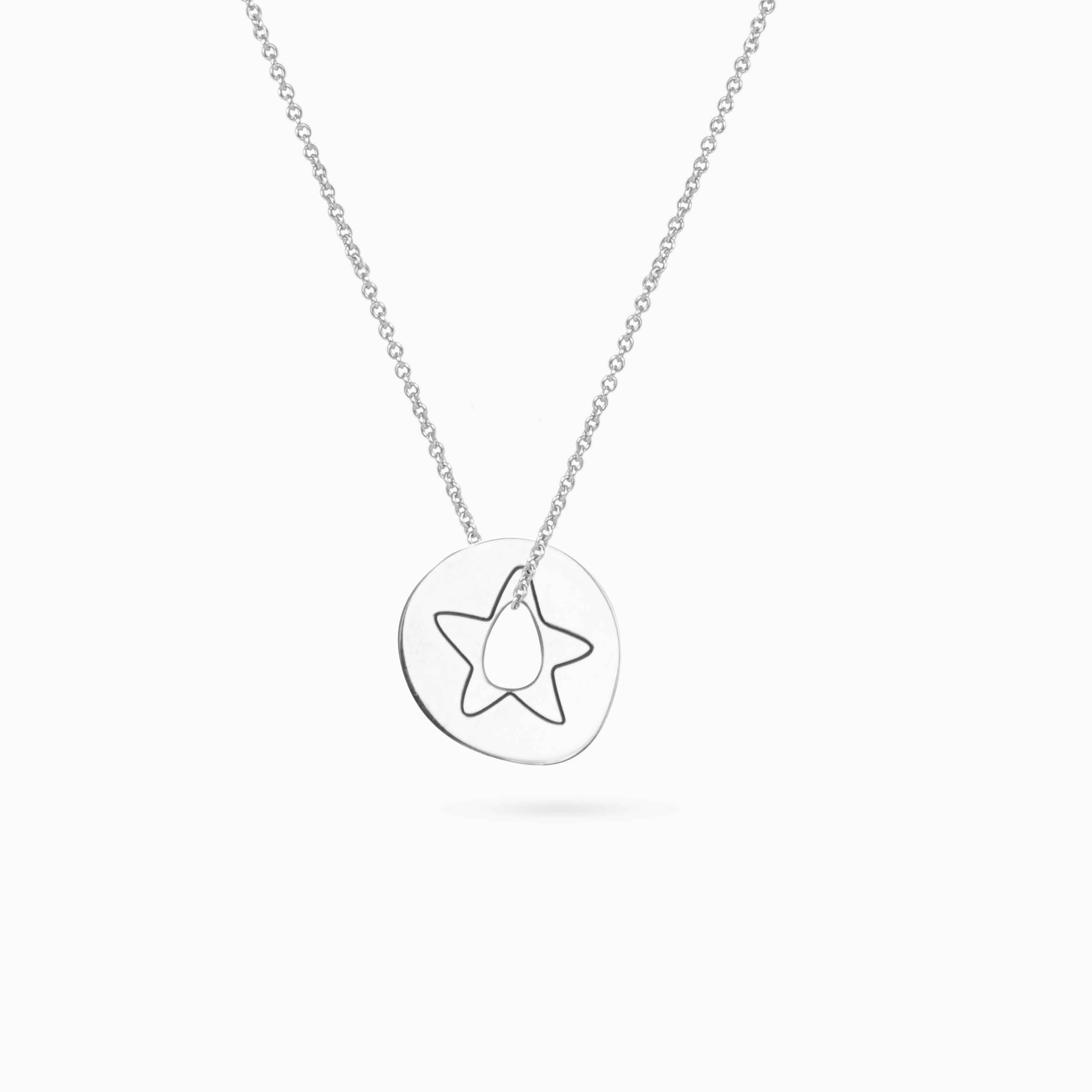 gold pendant with a star on a woman