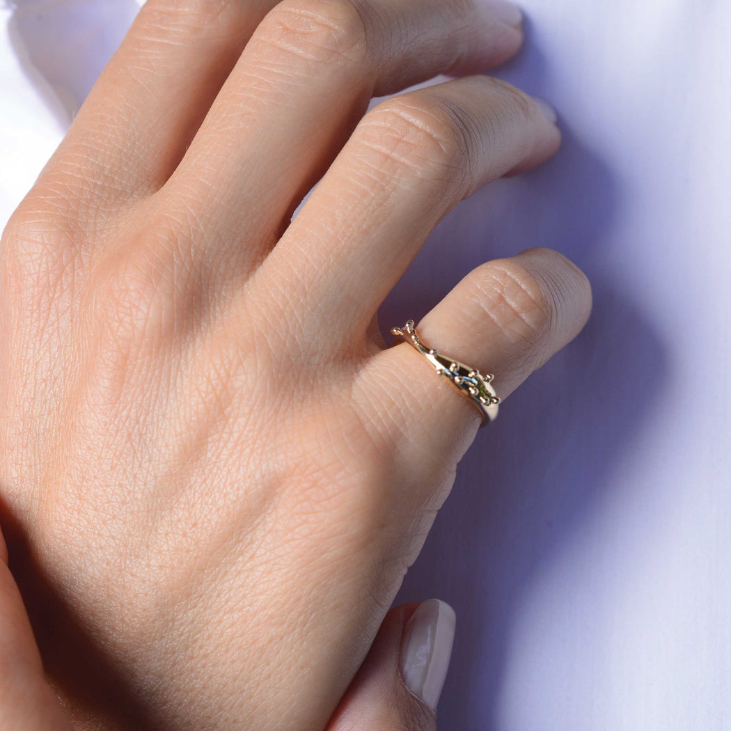 gold ring on woman hand