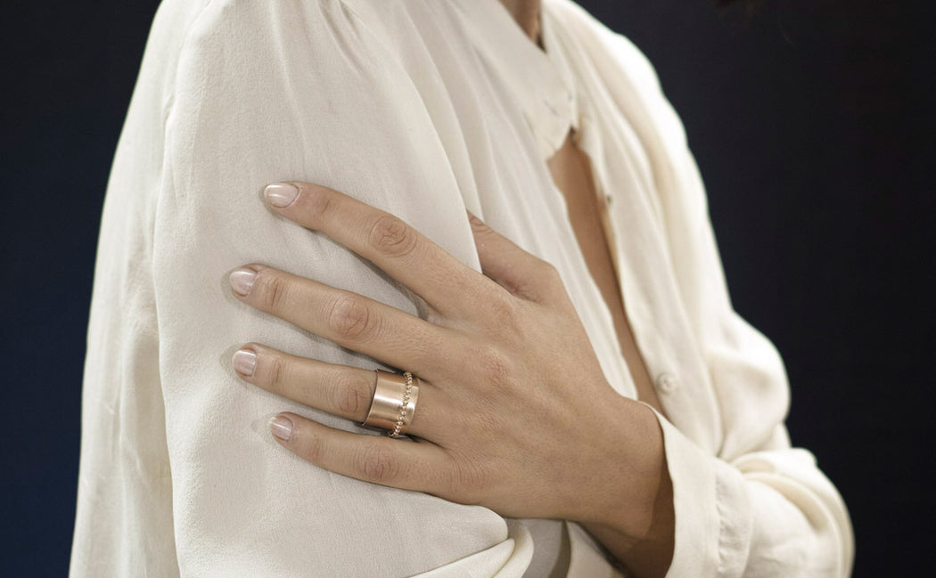 pink gold ring on a woman hand